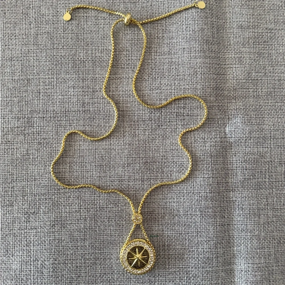 Gold Tone Compass Starburst Pendant Necklace with Crystal Halo